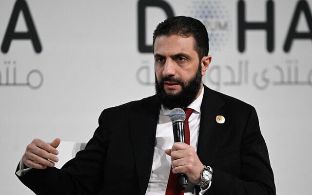 Syrian President Ahmed al-Sharaa speaks during the opening day of the Doha Forum, an annual diplomatic conference, in Doha on December 6, 2025. (Mahmud HAMS / AFP)