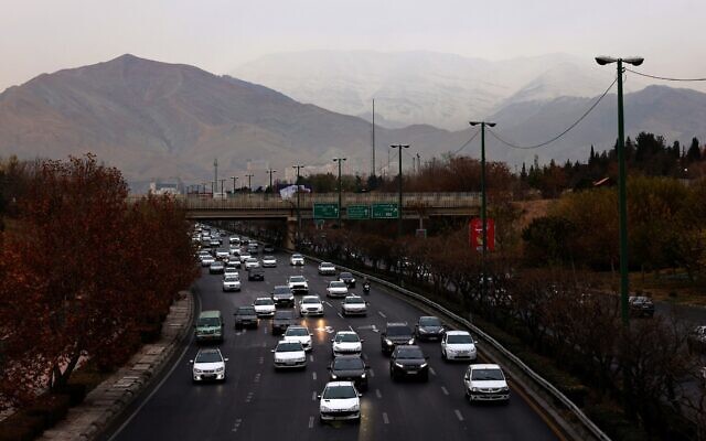 A general view shows the Iranian capital Tehran with the snow-covered Alborz mountain range in the background on December 8, 2025. (ATTA KENARE / AFP) A general view shows the Iranian capital Tehran with the snow-covered Alborz mountain range in the background on December 8, 2025. (ATTA KENARE / AFP)