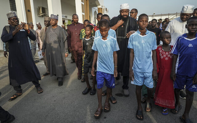 Nigerian school children who had been kidnapped by armed men arrive at the government headquarters in Minna, the capital of Niger State in central-northern Nigeria, December 8, 2025. (Light Oriye Tamunotonye/AFP)