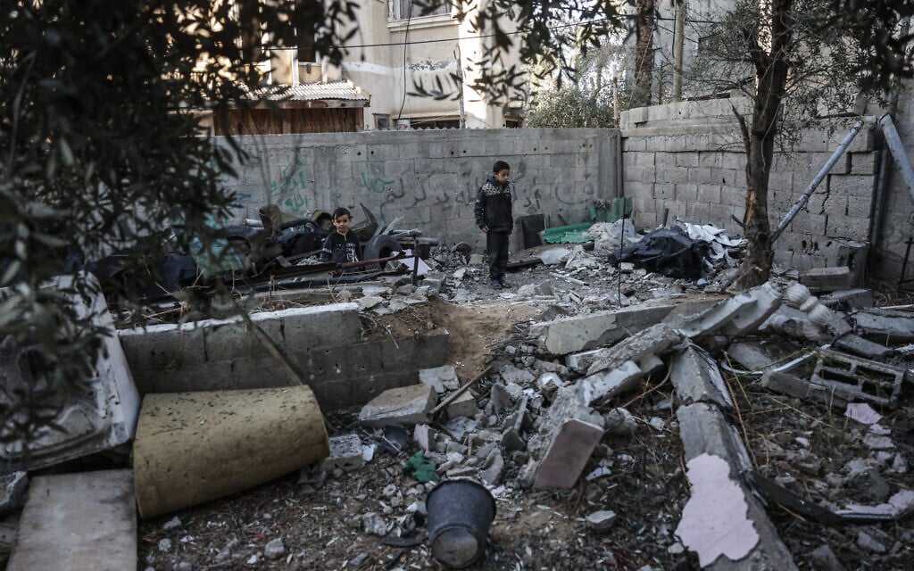 A young boy looks on at the site of a reported Israeli airstrike in Deir al-Balah, Gaza, on December 9, 2025. (BASHAR TALEB / AFP) A young boy looks on at the site of a reported Israeli airstrike in Deir al-Balah, Gaza, on December 9, 2025. (BASHAR TALEB / AFP)