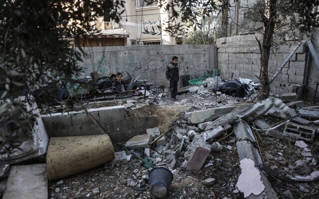 A young boy looks on at the site of a reported Israeli airstrike in Deir al-Balah, Gaza, on December 9, 2025 (BASHAR TALEB / AFP) A young boy looks on at the site of a reported Israeli airstrike in Deir al-Balah, Gaza, on December 9, 2025 (BASHAR TALEB / AFP)
