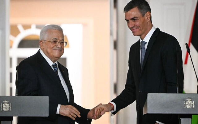 Palestinian Authority President Mahmoud Abbas (L) shakes hands with Spanish Prime Minister Pedro Sanchez after delivering remarks following their meeting at the Moncloa Palace in Madrid on December 12, 2025. (Photo by Javier SORIANO / AFP) Palestinian Authority President Mahmoud Abbas (L) shakes hands with Spanish Prime Minister Pedro Sanchez after delivering remarks following their meeting at the Moncloa Palace in Madrid on December 12, 2025. (Photo by Javier SORIANO / AFP)