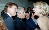 This undated photo from the personal collection of Jeffrey Epstein provided by the Democrats on the House Oversight Committee on December 12, 2025, shows US President Donald Trump (L), flanked by Epstein (C), talking to an unknown woman. (HANDOUT/House Oversight Democrats/AFP)