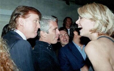 This undated photo from the personal collection of Jeffrey Epstein provided by the Democrats on the House Oversight Committee on December 12, 2025, shows US President Donald Trump (L), flanked by Epstein (C), talking to an unknown woman. (HANDOUT/House Oversight Democrats/AFP)