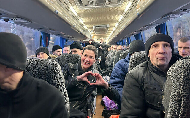 This handout photograph taken and released by the Coordination Headquarters for the Treatment of Prisoners of War on December 13, 2025, shows Belarusian opposition leader Maria Kalesnikava (C) making a heart sign with her hands as she sits in a bus among other former prisoners at an undisclosed location in Ukraine. (Handout / COORDINATION HEADQUARTERS FOR THE TREATMENT OF PRISONERS OF WAR / AFP) This handout photograph taken and released by the Coordination Headquarters for the Treatment of Prisoners of War on December 13, 2025, shows Belarusian opposition leader Maria Kalesnikava (C) making a heart sign with her hands as she sits in a bus among other former prisoners at an undisclosed location in Ukraine. (Handout / COORDINATION HEADQUARTERS FOR THE TREATMENT OF PRISONERS OF WAR / AFP)