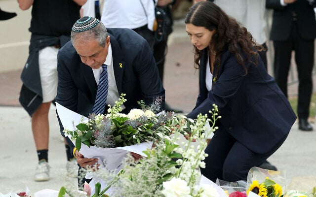 Israeli Ambassador to Australia Amir Maimon (L) lays flowers at the Bondi Pavilion memorial in Sydney on December 16, 2025, honoring the victims of the deadly Bondi Beach terror attack on a Hanukkah event. (David Gray/AFP)
