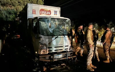 Lebanese soldiers secure the site of an Israeli drone strike that targeted a truck in the village of Sibline, south of Beirut, on December 16, 2025. (Mahmoud ZAYYAT / AFP)