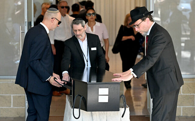 The coffin of Rabbi Yaakov Levitan, who was killed in the December 14 Bondi Beach terror attack, arrives at the Macquarie Park Cemetery in Sydney on December 17, 2025. (Saeed KHAN / AFP)