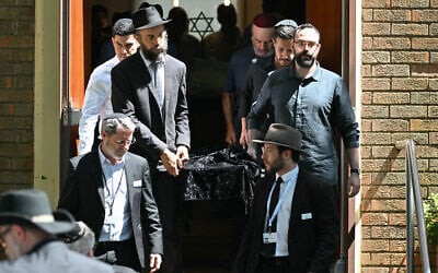 Pallbearers carry out a coffin after the funeral of Boris and Sofia Gurman, who were killed while trying to thwart the Bondi Beach terror shooting, at the Sydney Chevra Kadisha on December 19, 2025. (Saeed Khan/AFP)