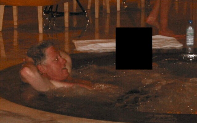 This photo provided by the US Justice Department on December 19, 2025, shows an undated picture of former US president Bill Clinton in a jacuzzi at an undisclosed location as the Justice Department began releasing long-awaited records from the investigation into Jeffrey Epstein. (Handout / US DEPARTMENT OF JUSTICE / AFP)