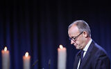 German Chancellor Friedrich Merz attends a commemorative ceremony at St. John's Church (Johanniskirche) one year after a deadly SUV rampage in which six people were killed and more than 300 wounded at the Christmas market in Magdeburg, eastern Germany, on December 20, 2025. (Ronny HARTMANN / AFP)
