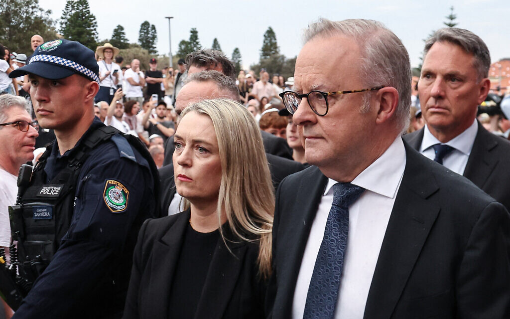 Australia's Prime Minister Anthony Albanese arrives with his wife Jodie Haydon on December 21, 2025, to attend the memorial held for the victims of the deadly terror shooting targeting a Jewish event at Bondi Beach in Sydney one week earlier. (DAVID GRAY / AFP)