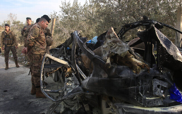 A Lebanese soldier inspects the wreckage of a car that was targeted in an Israeli air strike near the southern Lebanese village of Mazraat al Qnaitra on December 22, 2025. (Mahmoud ZAYYAT / AFP) A Lebanese soldier inspects the wreckage of a car that was targeted in an Israeli air strike near the southern Lebanese village of Mazraat al Qnaitra on December 22, 2025. (Mahmoud ZAYYAT / AFP)