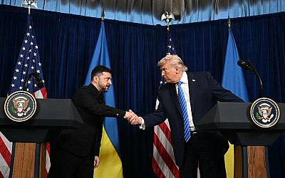 US President Donald Trump and Ukranian President Volodymyr Zelensky shake hands during a press conference following talks at Trump's Mar-a-Lago residence in Palm Beach, Florida, on December 28, 2025. (Jim WATSON / AFP)