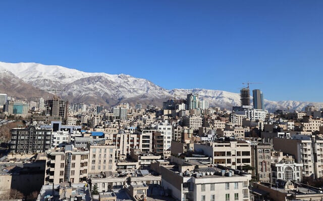 A photograph shows the Iranian capital Tehran with the snow-covered Alborz mountain range in the background on December 29, 2025 (ATTA KENARE / AFP) A photograph shows the Iranian capital Tehran with the snow-covered Alborz mountain range in the background on December 29, 2025 (ATTA KENARE / AFP)