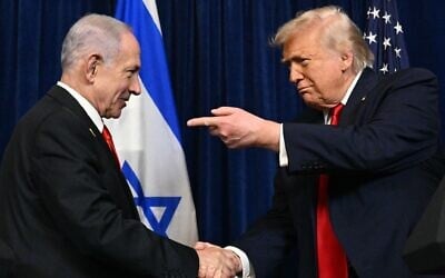US President Donald Trump (right) and Prime Minister Benjamin Netanyahu shake hands during a joint press conference at the Mar-a-Lago residence in Palm Beach, Florida, December 29, 2025. (Jim WATSON / AFP)