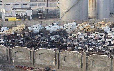 A photograph shows damaged military vehicles, reportedly sent by the United Arab Emirates to support Southern Transitional Council (STC) separatist forces, following an air strike carried out by the Saudi-led coalition in the port of Mukalla, southern Yemen, on December 30, 2025. (Photo by AFP)