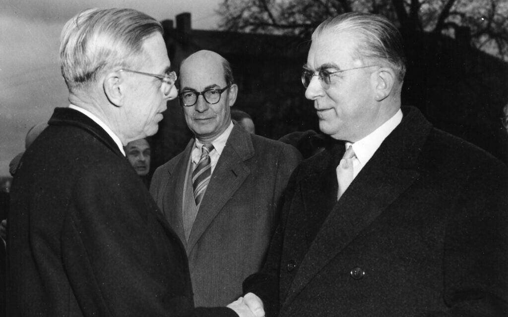 Retiring US ambassador James B. Conant bids farewell to Dr. Hans Globke, right, state secretary in the chancellery and former Nazi official, before leaving to return to the US from the Mehlem railroad station, near the US embassy, in Bonn, Germany, February 19, 1957. (AP Photos/Horst Faas) Retiring US ambassador James B. Conant bids farewell to Dr. Hans Globke, right, state secretary in the chancellery and former Nazi official, before leaving to return to the US from the Mehlem railroad station, near the US embassy, in Bonn, Germany, February 19, 1957. (AP Photos/Horst Faas)