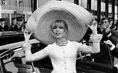 French actress Brigitte Bardot poses with a huge sombrero she brought back from Mexico, as she arrives at Orly Airport in Paris on May 27, 1965. (AP/File) French actress Brigitte Bardot poses with a huge sombrero she brought back from Mexico, as she arrives at Orly Airport in Paris on May 27, 1965. (AP/File)