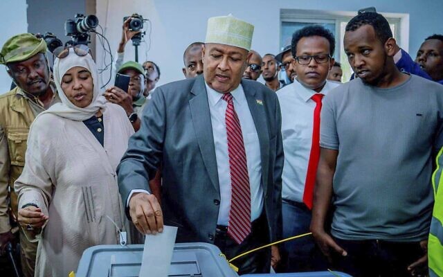 Presidential candidate Abdirahman Mohamed Abdullahi, center, casts his vote inside a polling station during the presidential election in Hargeisa, Somaliland, November 13, 2024. (AP/Abdirahman Aleeli)