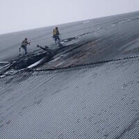 A view of the containment vessel that protects the remains of reactor number four at the former Chernobyl nuclear power plant and built to contain radiation, after a drone attack, Ukraine, February 14, 2025. (AP Photo/Efrem Lukatsky)