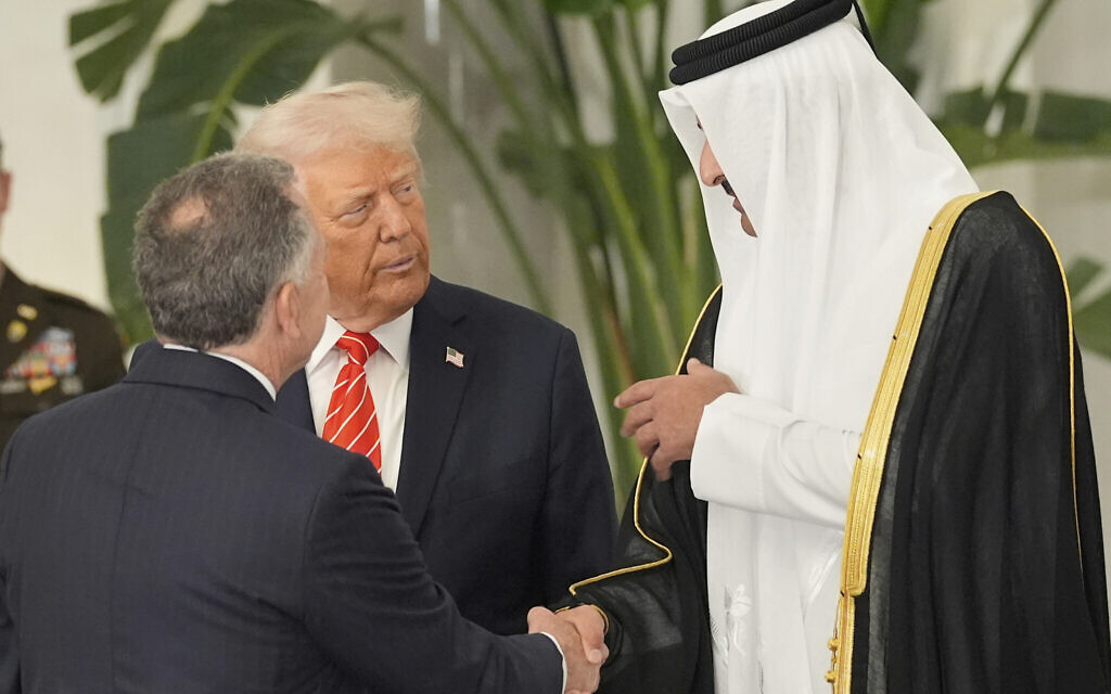 Qatar's Emir Sheikh Tamim bin Hamad Al Thani shakes hands with White House Special Envoy Steve Witkoff, as they speak with President Donald Trump before a state dinner at Lusail Palace in Doha, Qatar, May 14, 2025. (AP Photo/Alex Brandon)