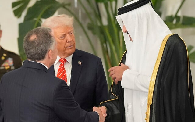 Qatar's Emir Sheikh Tamim bin Hamad Al Thani shakes hands with White House Special Envoy Steve Witkoff, as they speak with President Donald Trump before a state dinner at Lusail Palace in Doha, Qatar, May 14, 2025. (AP Photo/Alex Brandon)