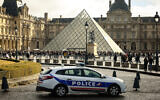 A police car outside the Louvre in Paris, October 26, 2025. (Thomas Padilla/AP)