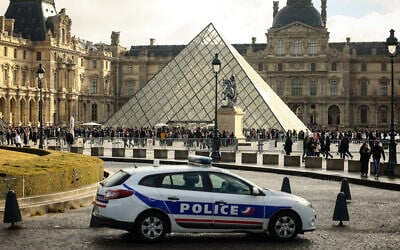 A police car outside the Louvre in Paris, October 26, 2025. (Thomas Padilla/AP)