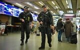 Illustrative: Armed police officers patrol the St. Pancras International train station, in London, England, November 3, 2025. (Kin Cheung/AP)