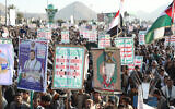 Supporters of the Houthi terror group gather as they celebrate independence day, marking the end of British rule in South Yemen in 1967, in Sanaa, Yemen, November 30, 2025. At front is a sign reading, "Death to America, death to Israel, curse on Jews." (AP/Osamah Abdulrahman)