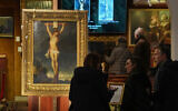 Long-lost painting 'Crucifixion of Jesus Christ' by Baroque master Peter Paul Rubens, which was hidden for more than four centuries, is displayed at the auction house Osenat in Versailles, west of Paris, Nov. 30, 2025. (AP Photo/Michel Euler)