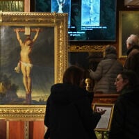 Long-lost painting 'Crucifixion of Jesus Christ' by Baroque master Peter Paul Rubens, which was hidden for more than four centuries, is displayed at the auction house Osenat in Versailles, west of Paris, Nov. 30, 2025. (AP Photo/Michel Euler)