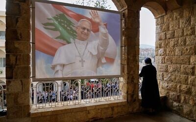 A nun looks from a balcony as people wait for the arrival of Pope Leo XIV at the De la Croix hospital in Jal el Dib, Lebanon, December 2, 2025. (Hassan Ammar/AP) A nun looks from a balcony as people wait for the arrival of Pope Leo XIV at the De la Croix hospital in Jal el Dib, Lebanon, December 2, 2025. (Hassan Ammar/AP)