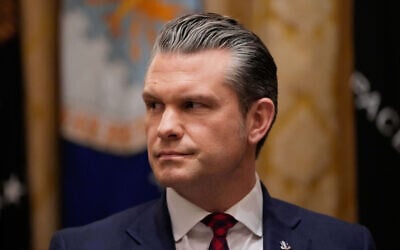 US Defense Secretary Pete Hegseth listens during a Cabinet meeting at the White House, Dec. 2, 2025, in Washington. (AP Photo/Julia Demaree Nikhinson)