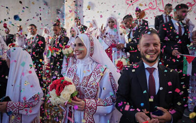 Palestinian couples participate in a mass wedding ceremony in Hamad City in Khan Younis, Gaza Strip, Tuesday, Dec. 2, 2025. (AP Photo/Abdel Kareem Hana) Palestinian couples participate in a mass wedding ceremony in Hamad City in Khan Younis, Gaza Strip, Tuesday, Dec. 2, 2025. (AP Photo/Abdel Kareem Hana)