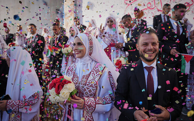 Palestinian couples participate in a mass wedding ceremony in Hamad City in Khan Younis, Gaza Strip, Tuesday, Dec. 2, 2025. (AP Photo/Abdel Kareem Hana) Palestinian couples participate in a mass wedding ceremony in Hamad City in Khan Younis, Gaza Strip, Tuesday, Dec. 2, 2025. (AP Photo/Abdel Kareem Hana)