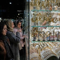 Women look at the window of a gold shop at a gold market in Tehran's Grand Bazaar, Iran, November 29, 2025. (AP Photo/Vahid Salemi)