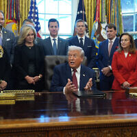 US President Donald Trump speaks during an event on fuel economy standards in the Oval Office of the White House, December 3, 2025, in Washington. (AP Photo/Evan Vucci)