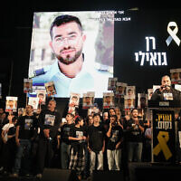 A photo of slain hostage Ran Gvili, whose remains are being held by Hamas in the Gaza Strip, is displayed during a rally calling for the return of the deceased hostages held in Gaza, in Tel Aviv, Israel, on Nov. 29, 2025. (AP Photo/Mahmoud Illean, File)