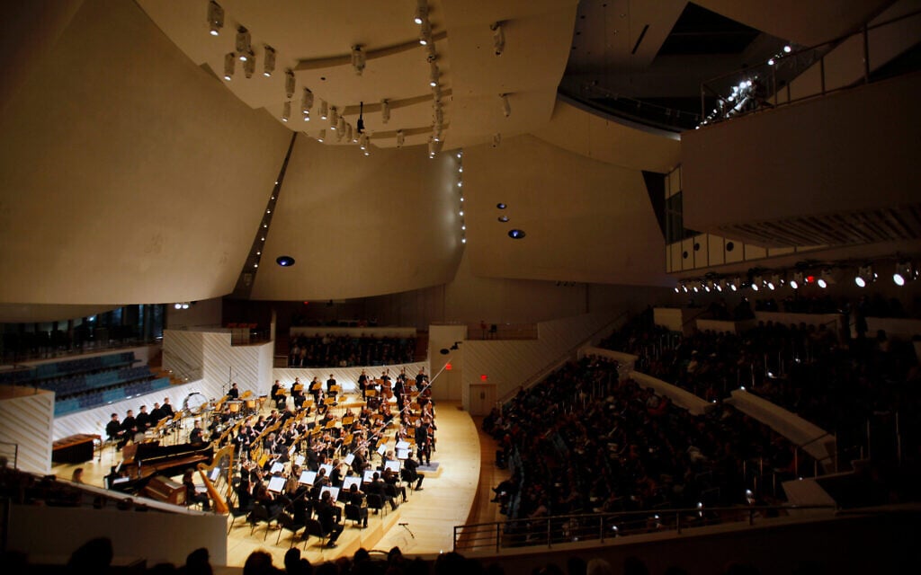 The New World Symphony performs under the direction of Michael Tilson Thomas, during the grand opening ceremony of the New World Center, a facility designed by architect Frank Gehry, January 25, 2011, in Miami Beach, Florida. (AP Photo/Lynne Sladky)