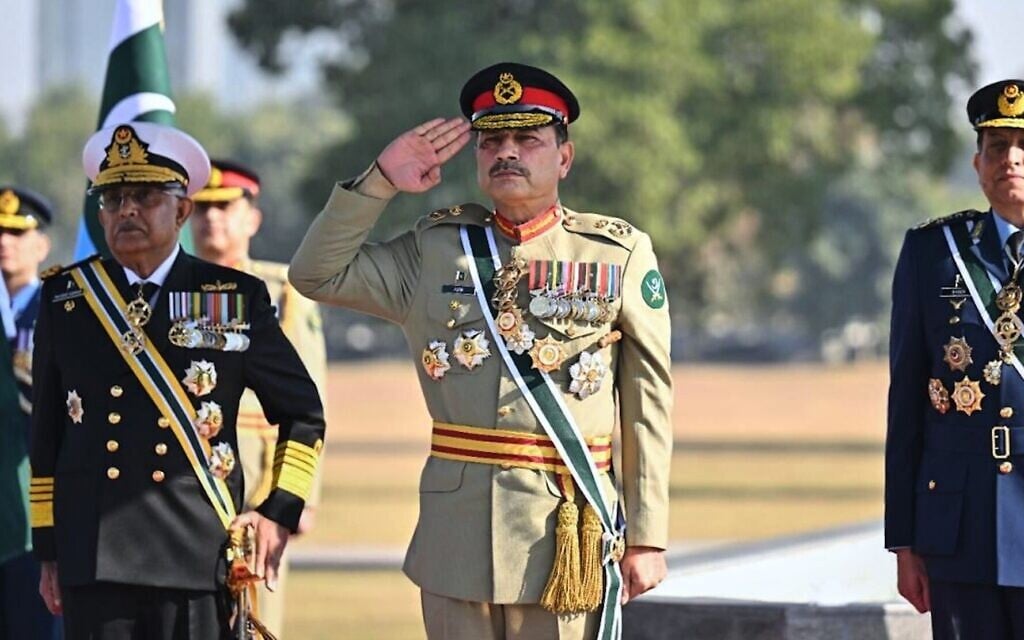 Pakistan's Chief of Defense Forces and Army Chief Field Marshal Asim Munir, center, Pakistan Naval Chief Admiral Naveed Ashraf, left, and Pakistan Air Force Chief Air Chief Marshal Zaheer Ahmed Babar attend a guard of honor ceremony at the joint military command headquarters in Rawalpindi, Pakistan, December 8, 2025. (Inter Services Public Relations via AP) Pakistan's Chief of Defense Forces and Army Chief Field Marshal Asim Munir, center, Pakistan Naval Chief Admiral Naveed Ashraf, left, and Pakistan Air Force Chief Air Chief Marshal Zaheer Ahmed Babar attend a guard of honor ceremony at the joint military command headquarters in Rawalpindi, Pakistan, December 8, 2025. (Inter Services Public Relations via AP)