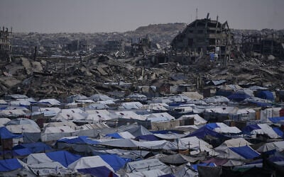 Tents sheltering displaced Palestinians stand amid the destruction left in Gaza City by the war between Israel and Hamas, December 5, 2025. (Abdel Kareem Hana/AP) Tents sheltering displaced Palestinians stand amid the destruction left in Gaza City by the war between Israel and Hamas, December 5, 2025. (Abdel Kareem Hana/AP)
