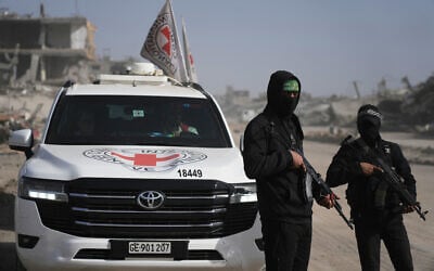 Hamas gunmen accompanied by members of the International Committee of the Red Cross head to Zeitoun neighborhood of Gaza City to search for the remains of the final hostage, December 8, 2025. (AP/Jehad Alshrafi) Hamas gunmen accompanied by members of the International Committee of the Red Cross head to Zeitoun neighborhood of Gaza City to search for the remains of the final hostage, December 8, 2025. (AP/Jehad Alshrafi)