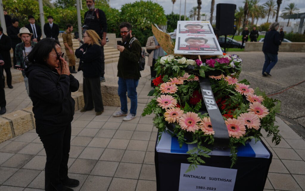 Members of the public attend the farewell ceremony for Sudthisak Rinthalak, a Thai national who was killed and taken hostage by Hamas into Gaza, before his body is flown back to Thailand for burial, at Ben Gurion Airport, Israel, Tuesday, Dec. 9, 2025. (AP Photo/Ariel Schalit) Members of the public attend the farewell ceremony for Sudthisak Rinthalak, a Thai national who was killed and taken hostage by Hamas into Gaza, before his body is flown back to Thailand for burial, at Ben Gurion Airport, Israel, Tuesday, Dec. 9, 2025. (AP Photo/Ariel Schalit)