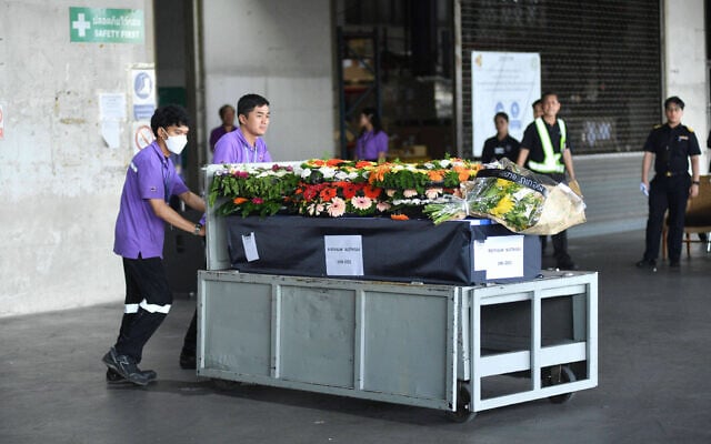 Workers move a coffin containing the body of Sudthisak Rinthalak, a Thai laborer who was killed and whose body was taken hostage by Hamas during the October 7, 2023, attack, as it arrives at Suvarnabhumi International Airport in Samut Prakarn, Thailand, December 10, 2025. (Surakit Kaewmorakot/AP) Workers move a coffin containing the body of Sudthisak Rinthalak, a Thai laborer who was killed and whose body was taken hostage by Hamas during the October 7, 2023, attack, as it arrives at Suvarnabhumi International Airport in Samut Prakarn, Thailand, December 10, 2025. (Surakit Kaewmorakot/AP)