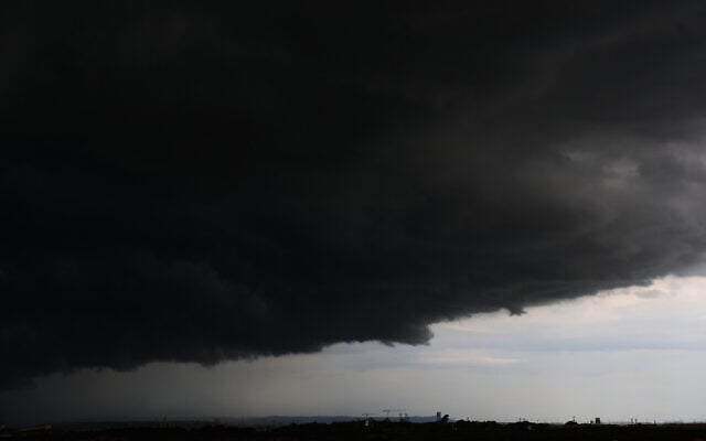 Storm clouds move over the Mediterranean Sea toward a freeway between Haifa and Tel Aviv, December 10, 2025. (AP/Ariel Schalit)