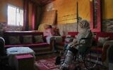 Haneen al-Mabhouh, 34, who lost her leg in an Israeli strike on her home that also killed all four of her daughters, including her 5-month-old baby, sits in a wheelchair in her family home in Nuseirat, central Gaza Strip, Thursday, Nov. 6, 2025. (AP Photo/Abdel Kareem Hana)