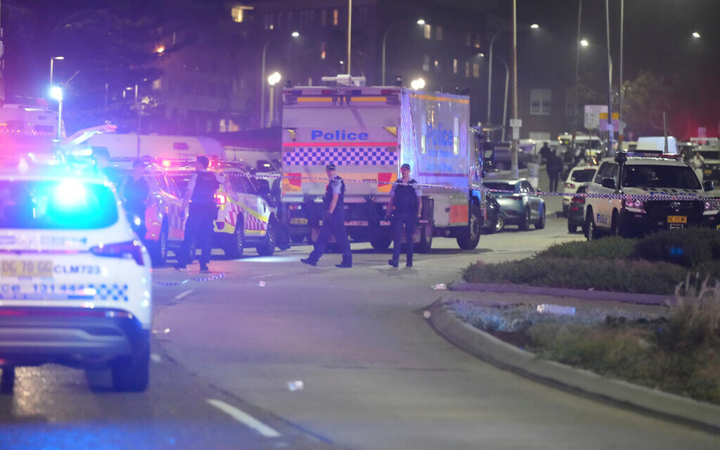 Police cordon off an area at Bondi Beach after a deadly terror shooting targeting a Jewish event in Sydney, December 14, 2025. (AP/Mark Baker) Police cordon off an area at Bondi Beach after a deadly terror shooting targeting a Jewish event in Sydney, December 14, 2025. (AP/Mark Baker)