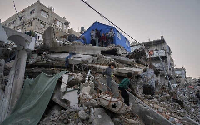 Children from the Abu Duheir family step down from their temporary tent, erected over the rubble of their collapsed home in the Sheikh Radwan neighborhood of Gaza City, on November 26, 2025. (AP Photo/Jehad Alshrafi) Children from the Abu Duheir family step down from their temporary tent, erected over the rubble of their collapsed home in the Sheikh Radwan neighborhood of Gaza City, on November 26, 2025. (AP Photo/Jehad Alshrafi)